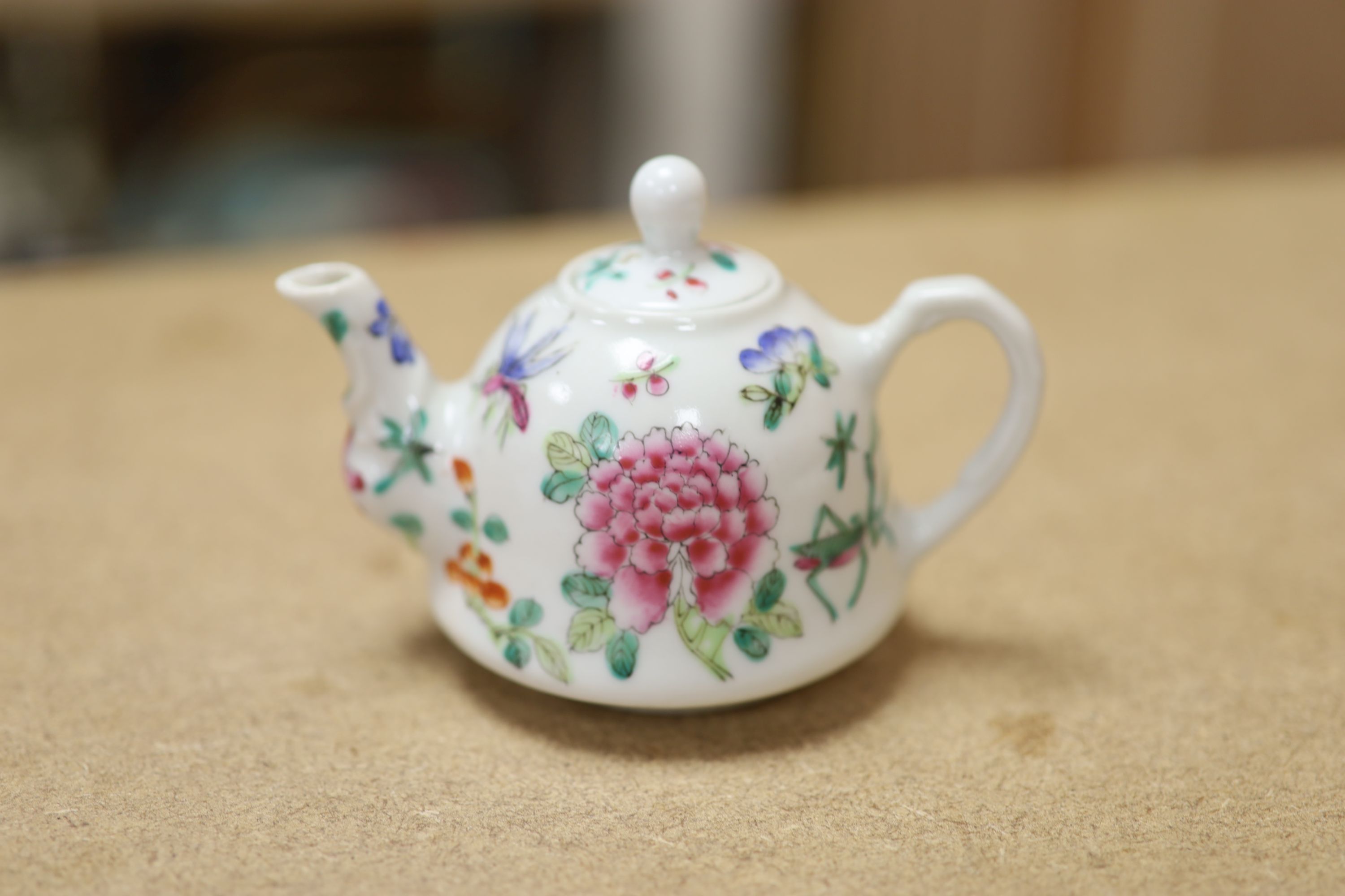 A Chinese Famille Rose miniature tea set with tray, length 18cm